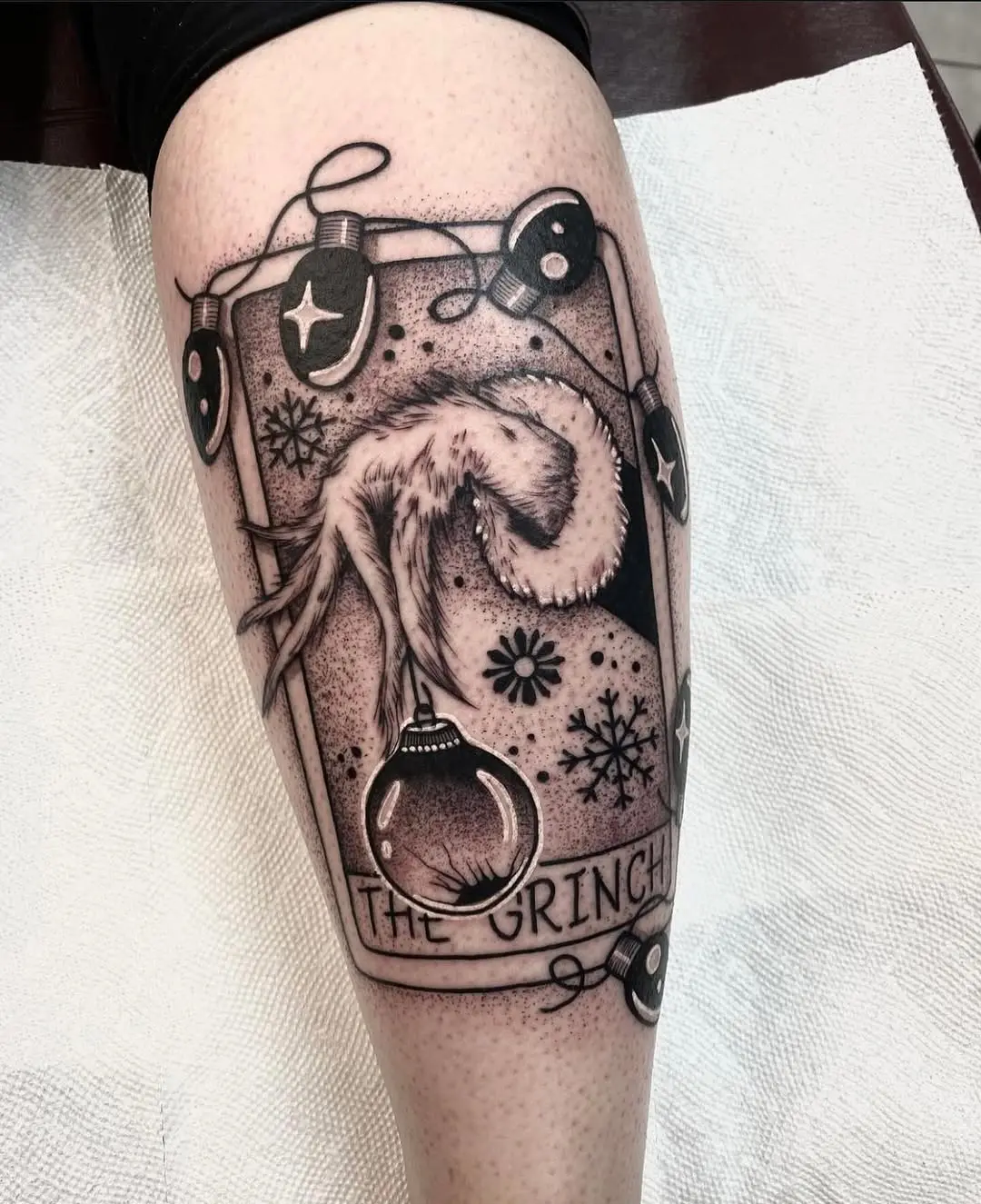 Creative Grinch Tattoo with Festive Ornaments