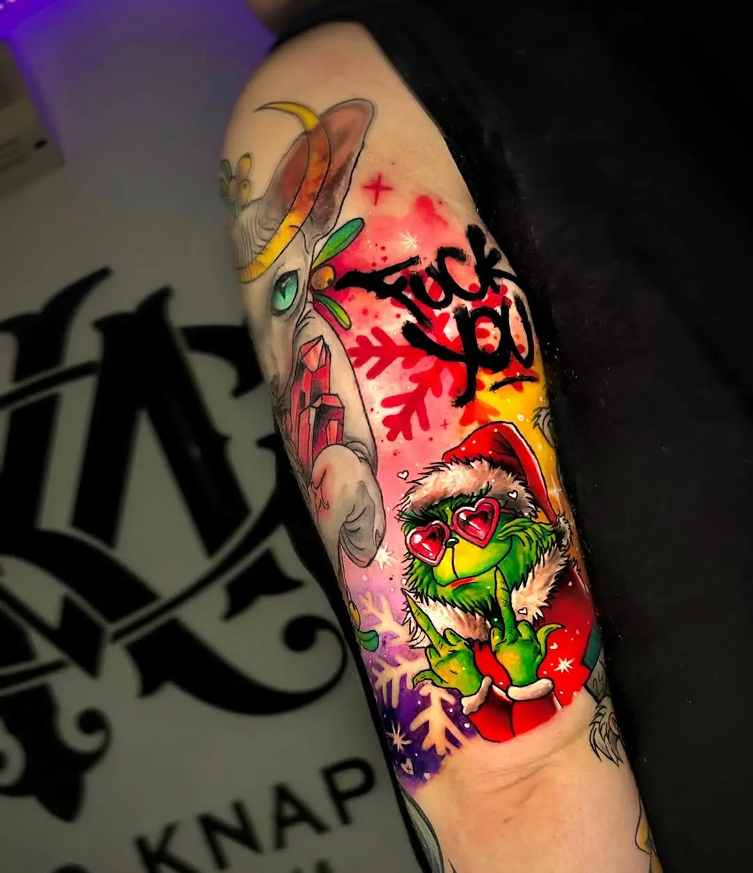 Vibrant Grinch Tattoo with a Twist