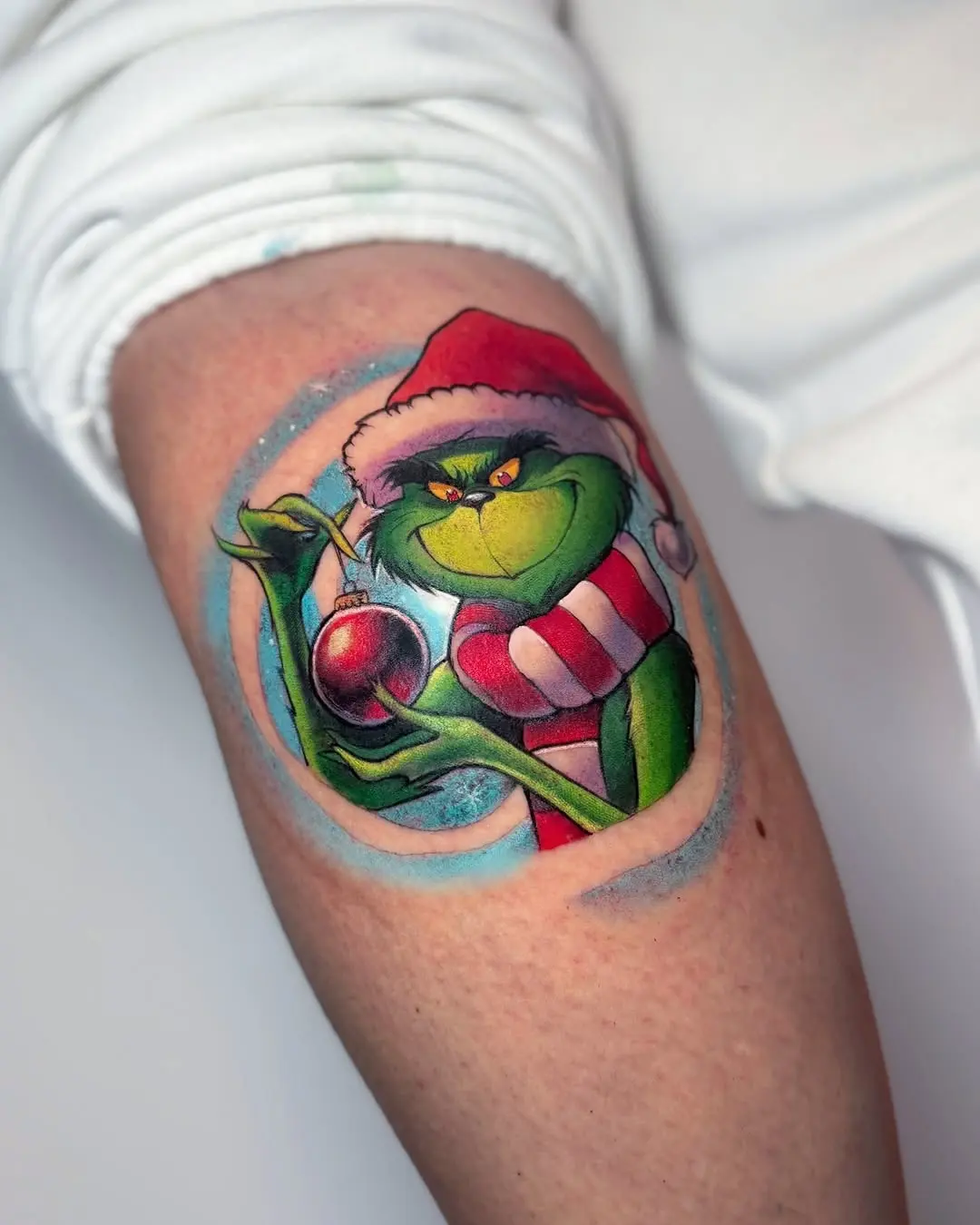 Vibrant Grinch Tattoo with Holiday Spirit