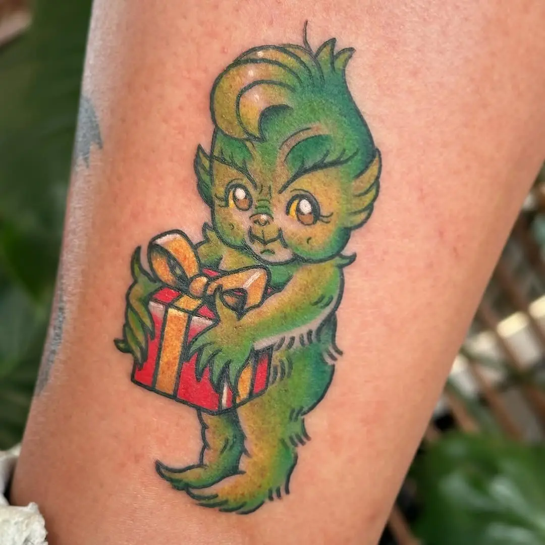 Whimsical Grinch Tattoo with Christmas Gift