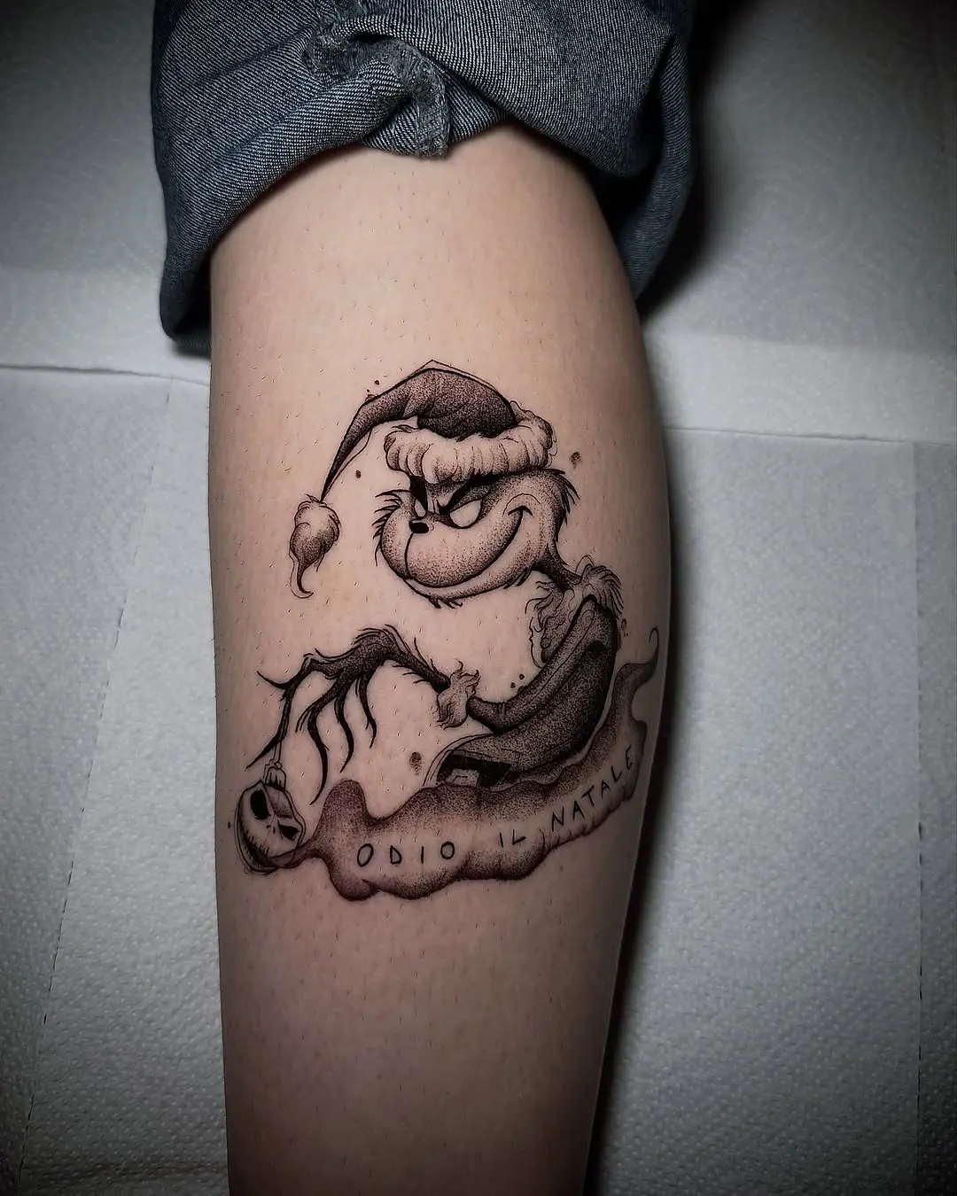 Whimsical Grinch Tattoo with Holiday Vibes