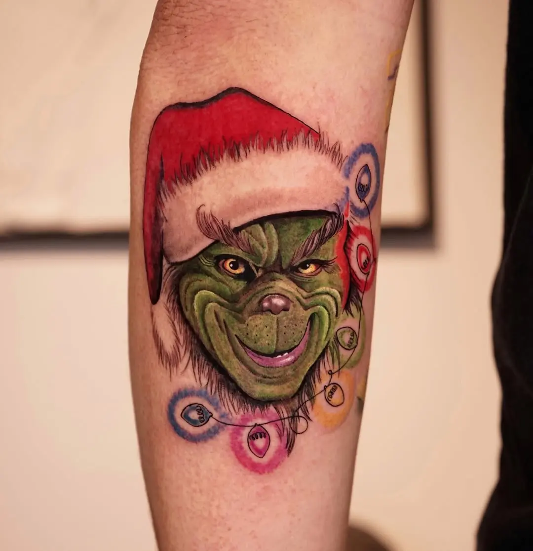 Unique Grinch tattoo with festive charm