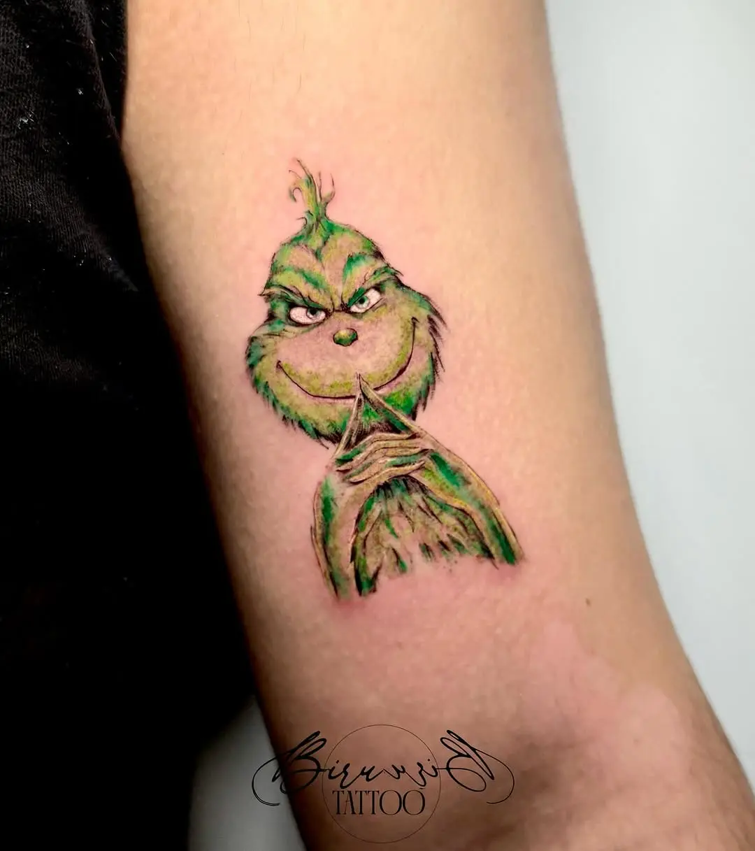 Cheeky Grinch Tattoo for Holiday Spirit