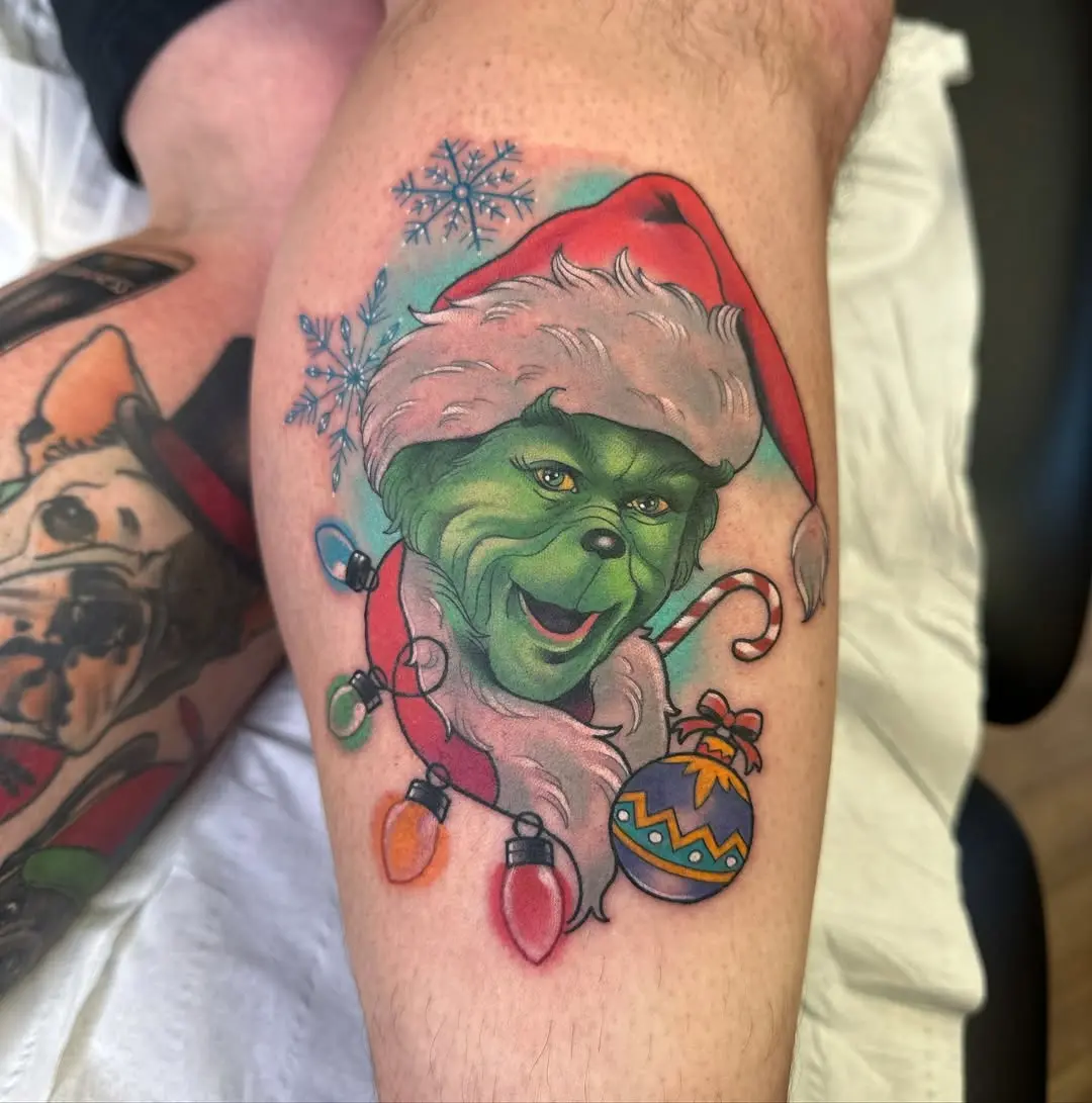 Festive Grinch Tattoo Capturing Holiday Cheer