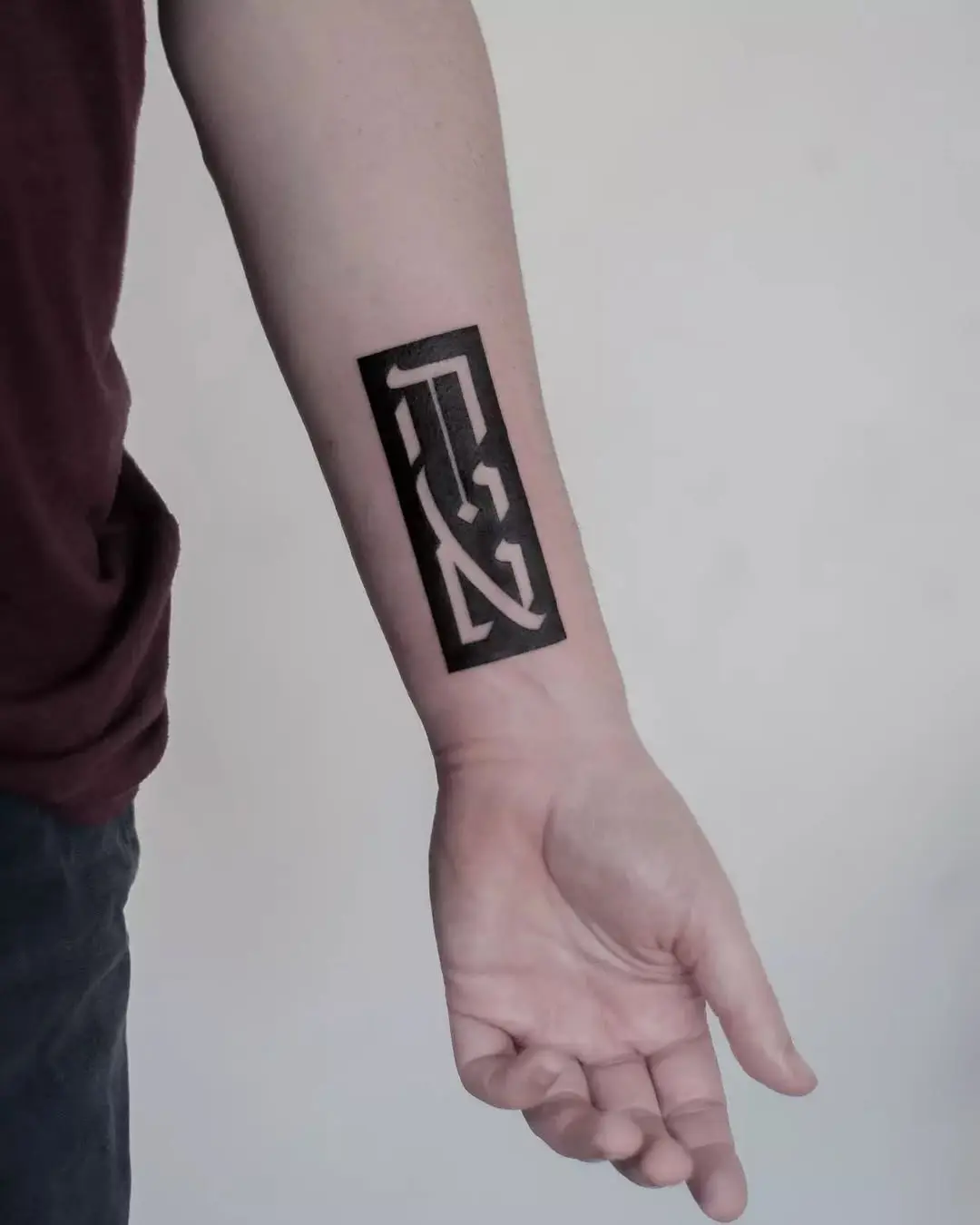 Striking Hebrew Tattoo in Bold Black Design