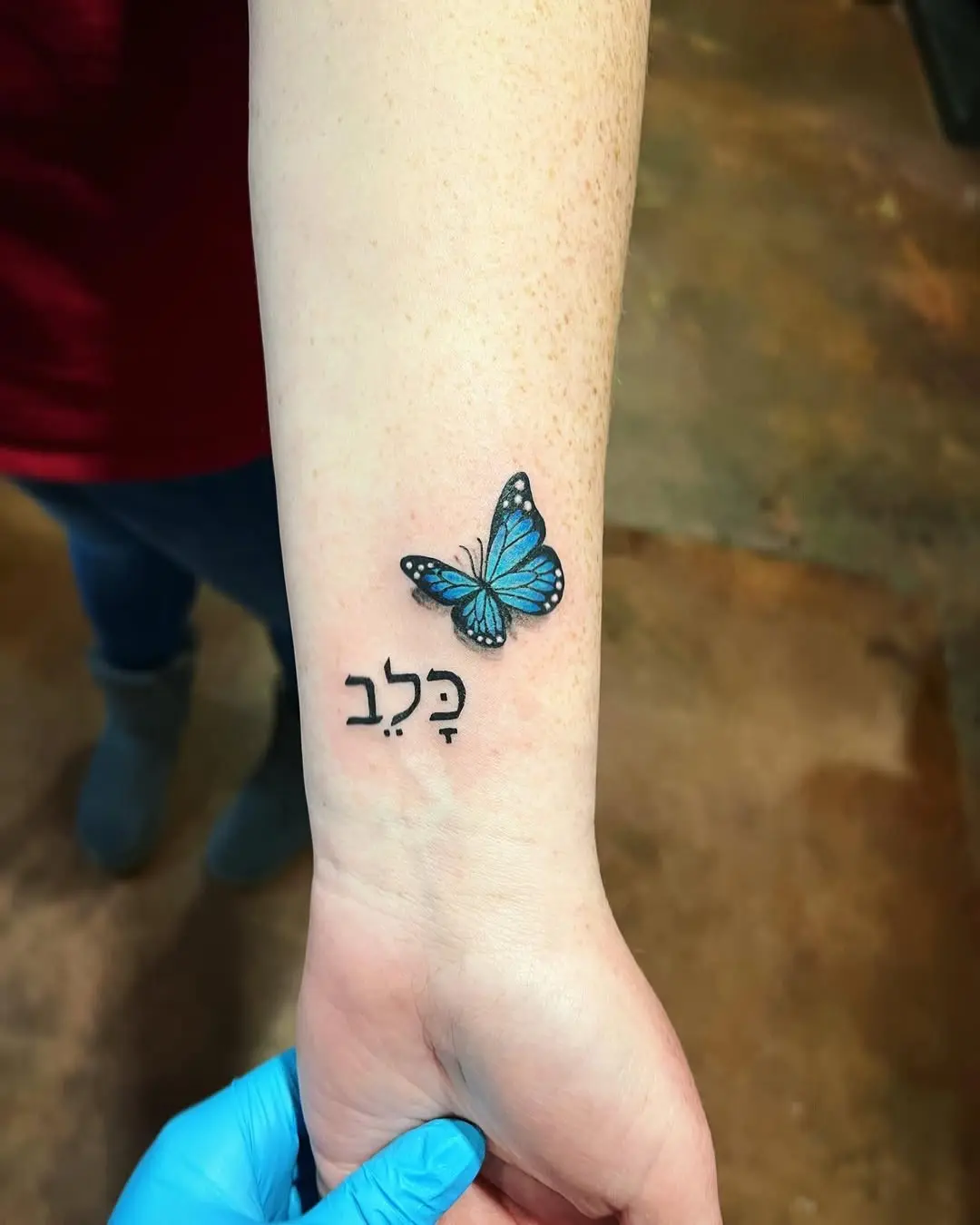 Elegant Hebrew Tattoo with Butterfly Design