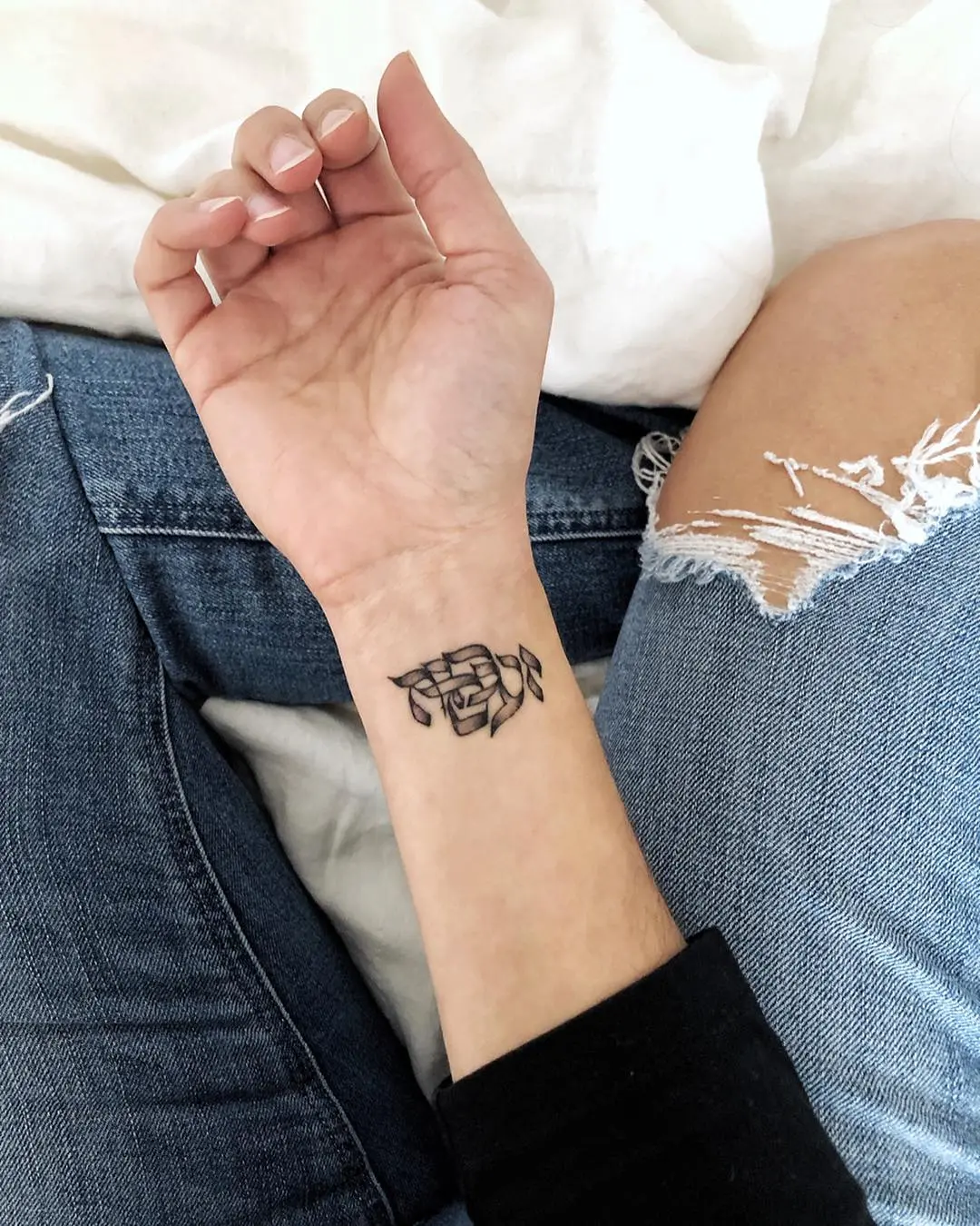 Elegant Hebrew Tattoo on the Wrist