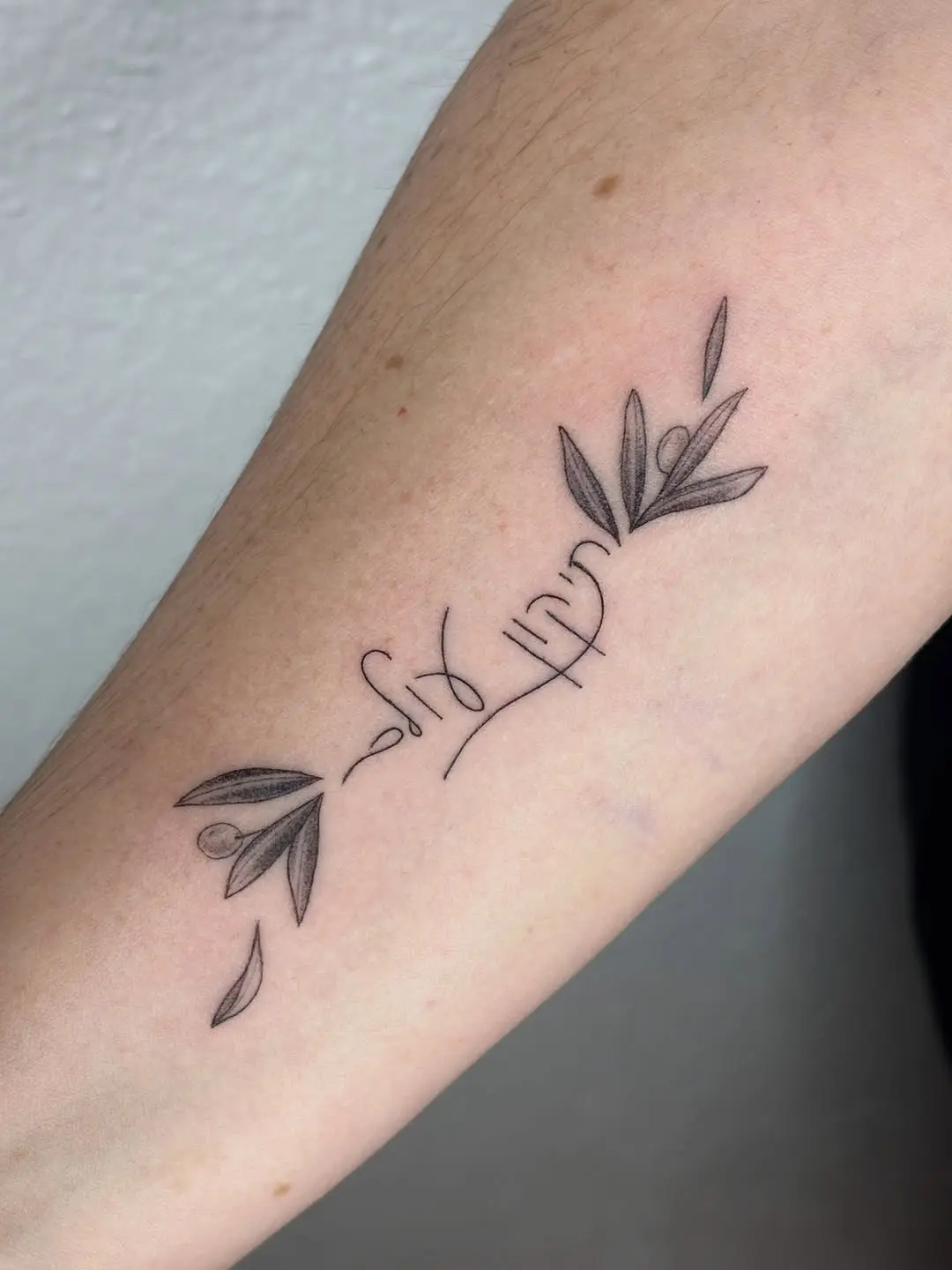 Elegant Hebrew Tattoo with Olive Branches