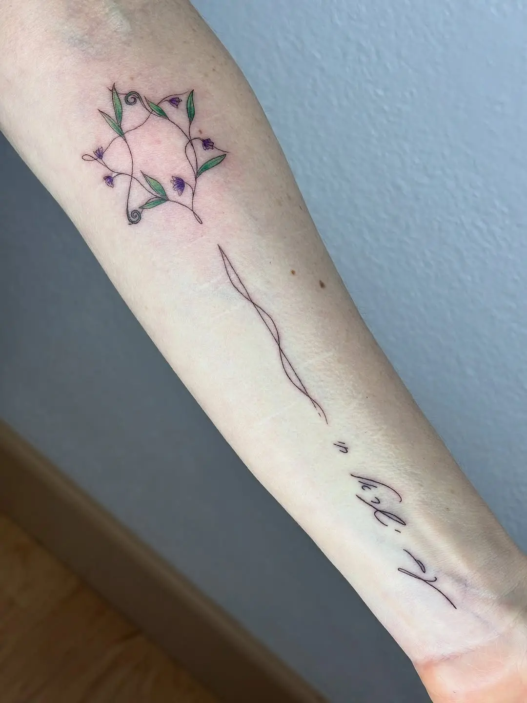 Delicate floral Hebrew tattoo design