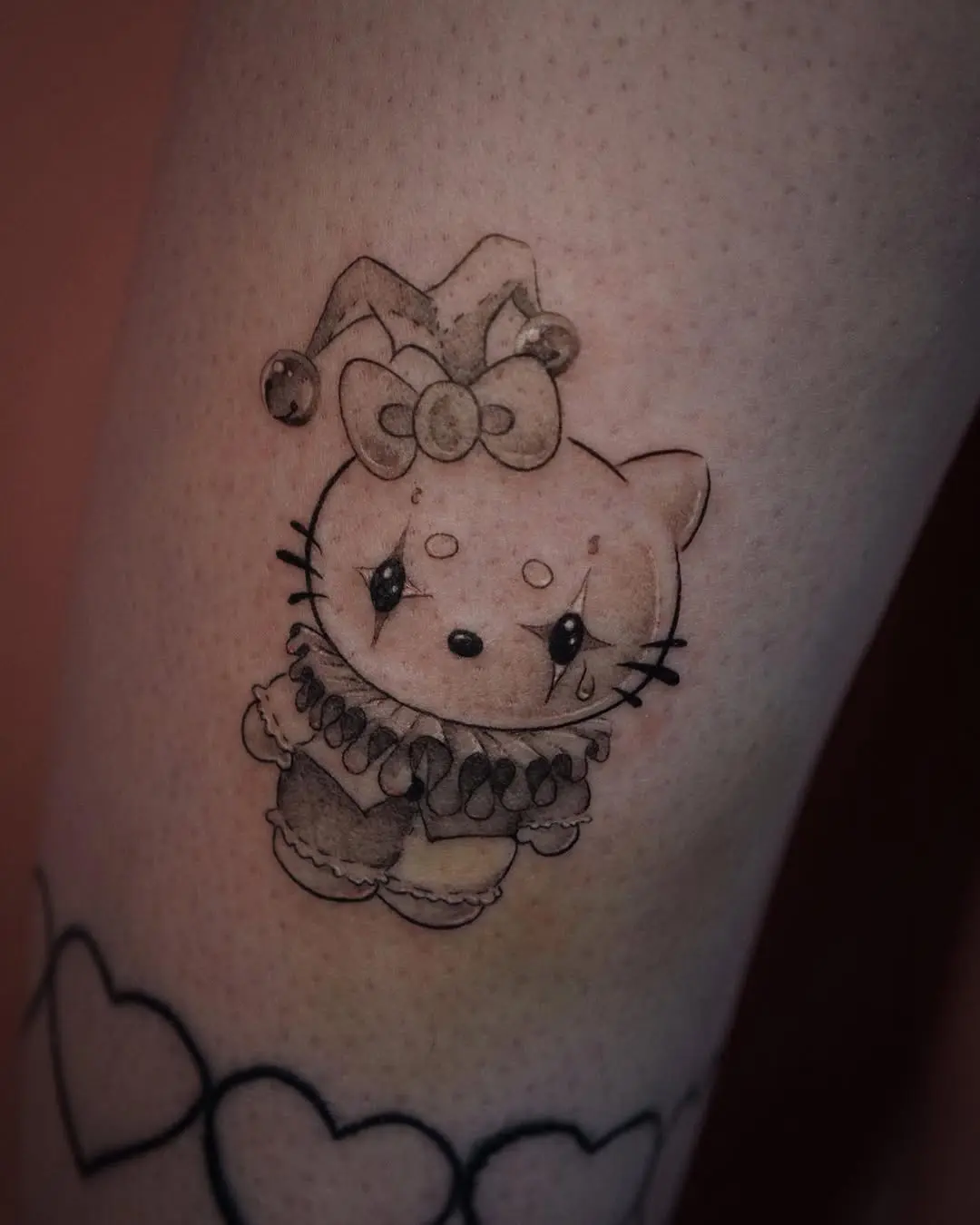 Whimsical Hello Kitty Clown Tattoo Inspiration