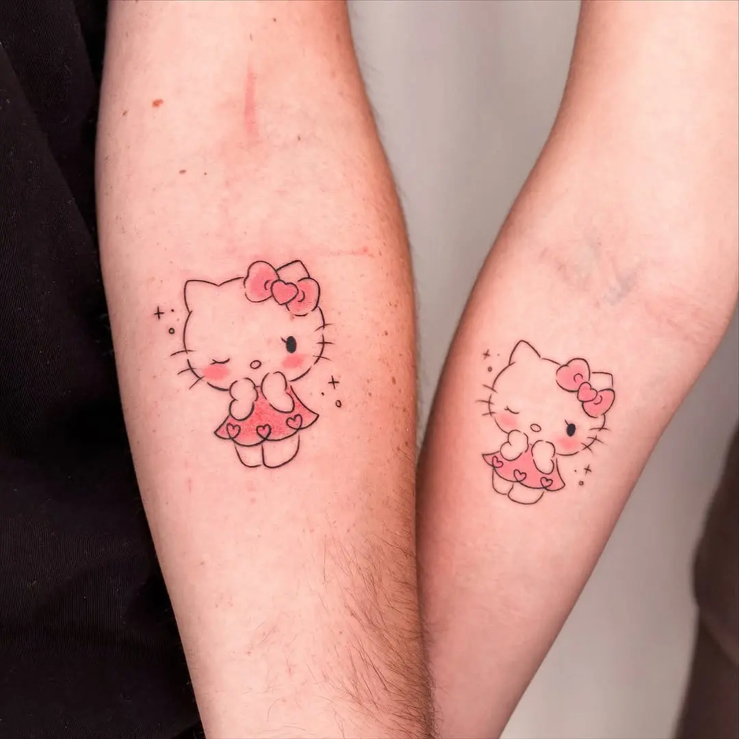 Cute Hello Kitty Couple Tattoos on Arms