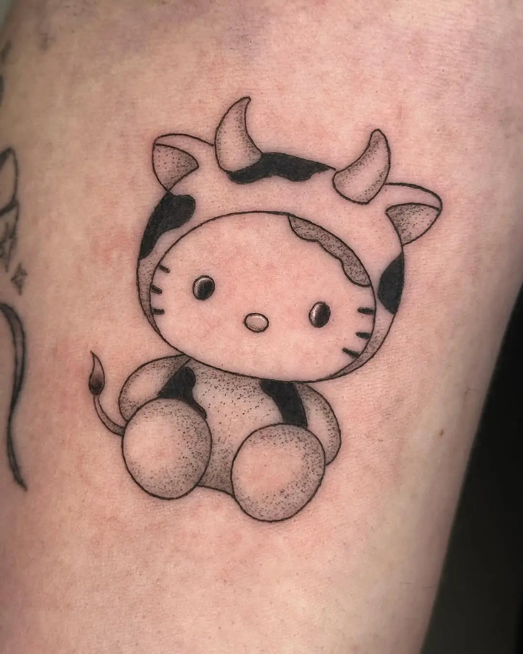 Adorable Hello Kitty Cow Tattoo Design