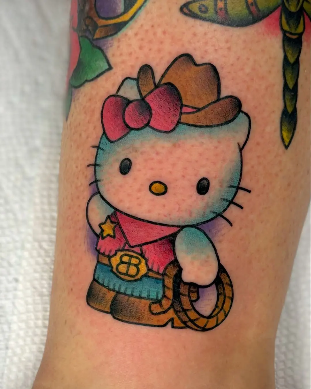 Cute cowgirl Hello Kitty tattoo design