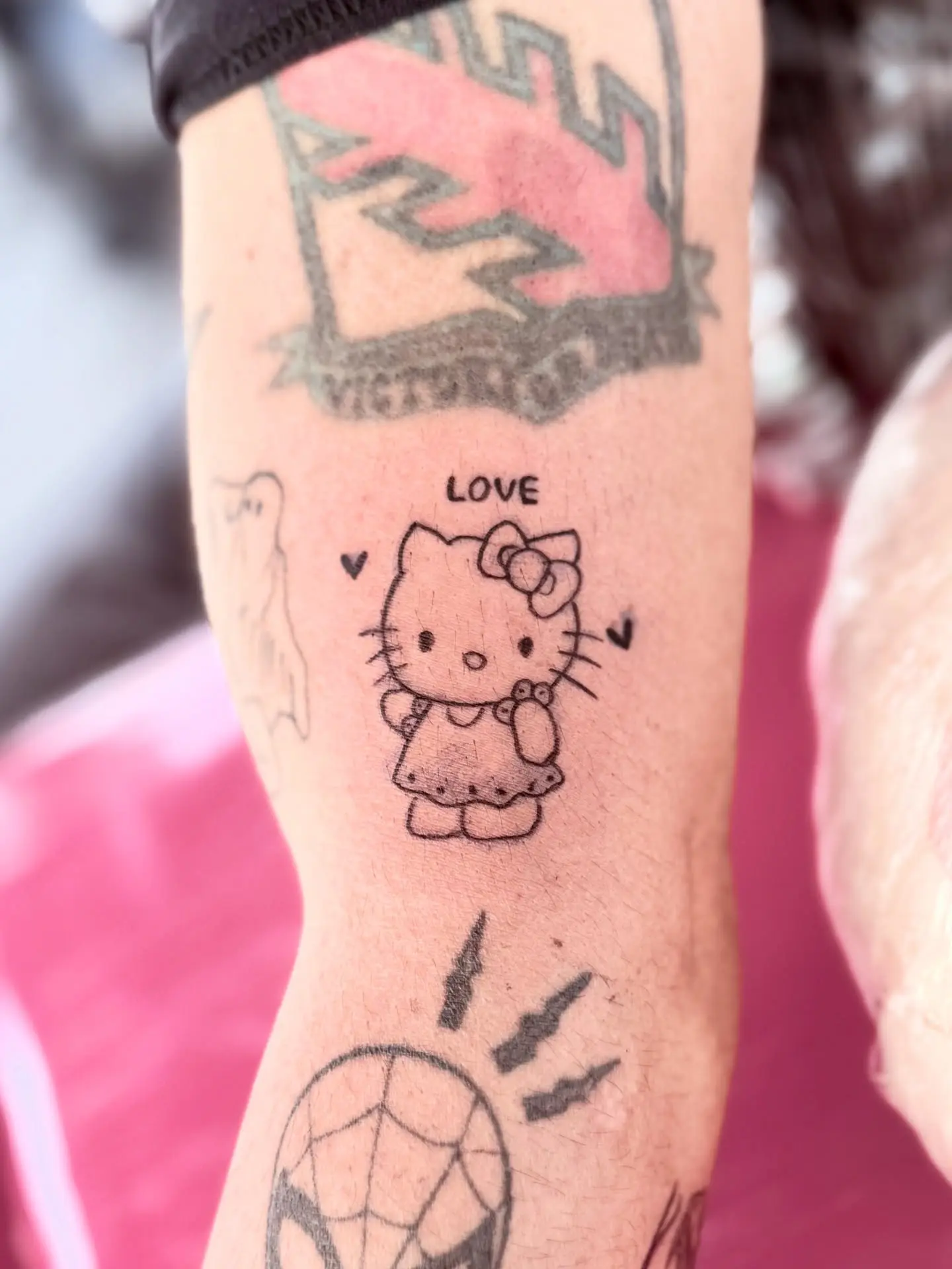 Charming Hello Kitty Love Tattoo Design
