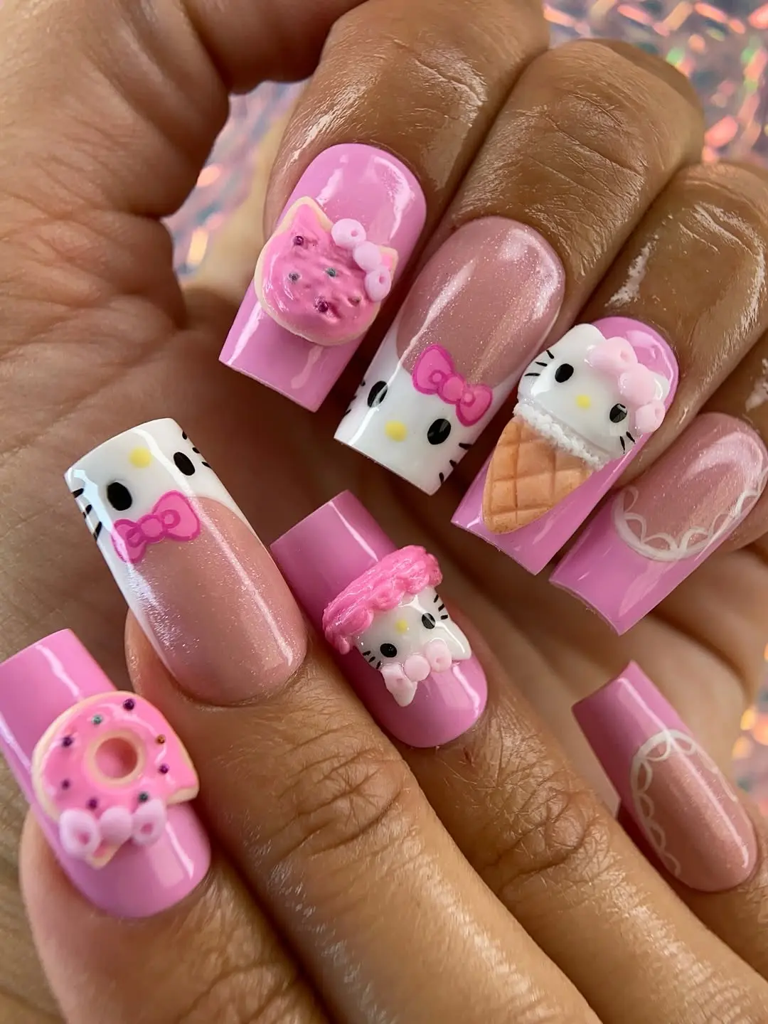 Playful Hello Kitty Nail Art with 3D Accents