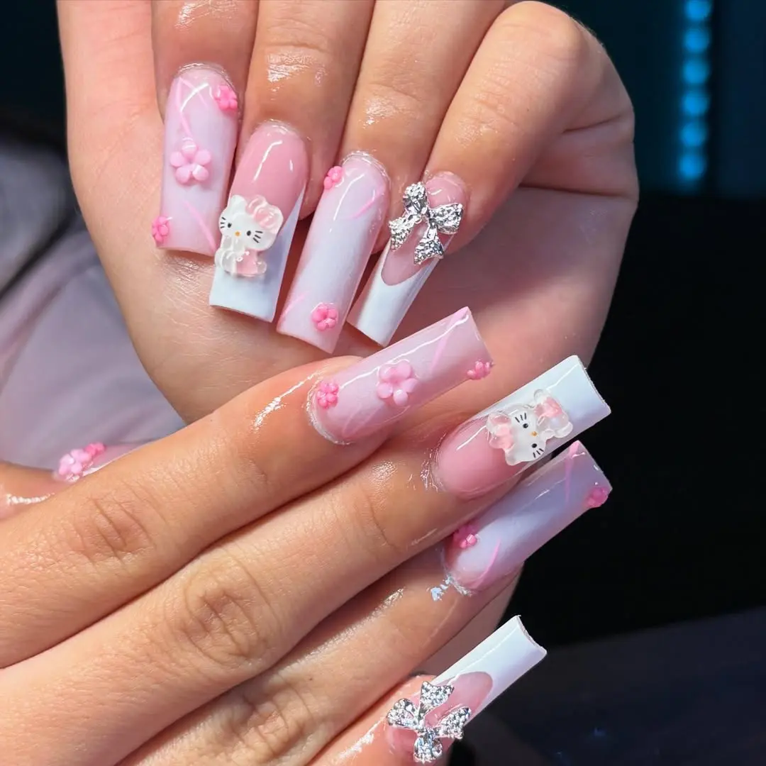 Chic Hello Kitty Nail Art with Floral Accents