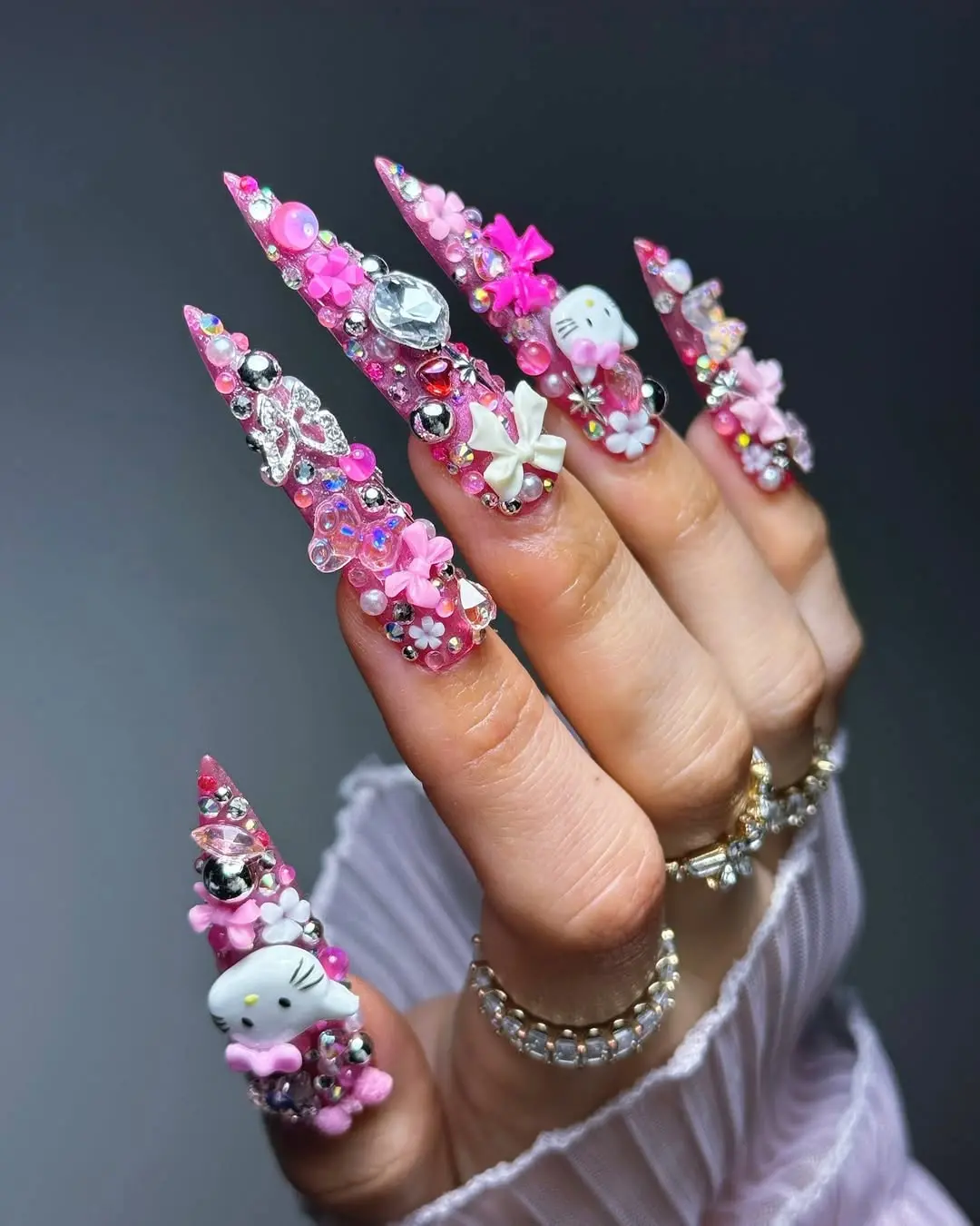 Chic Hello Kitty Nail Art with Studded Elegance