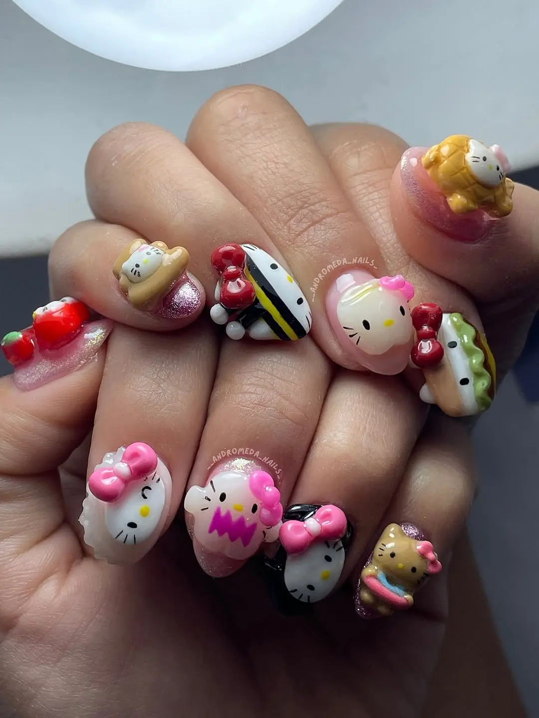 Bright and playful Hello Kitty nail art design