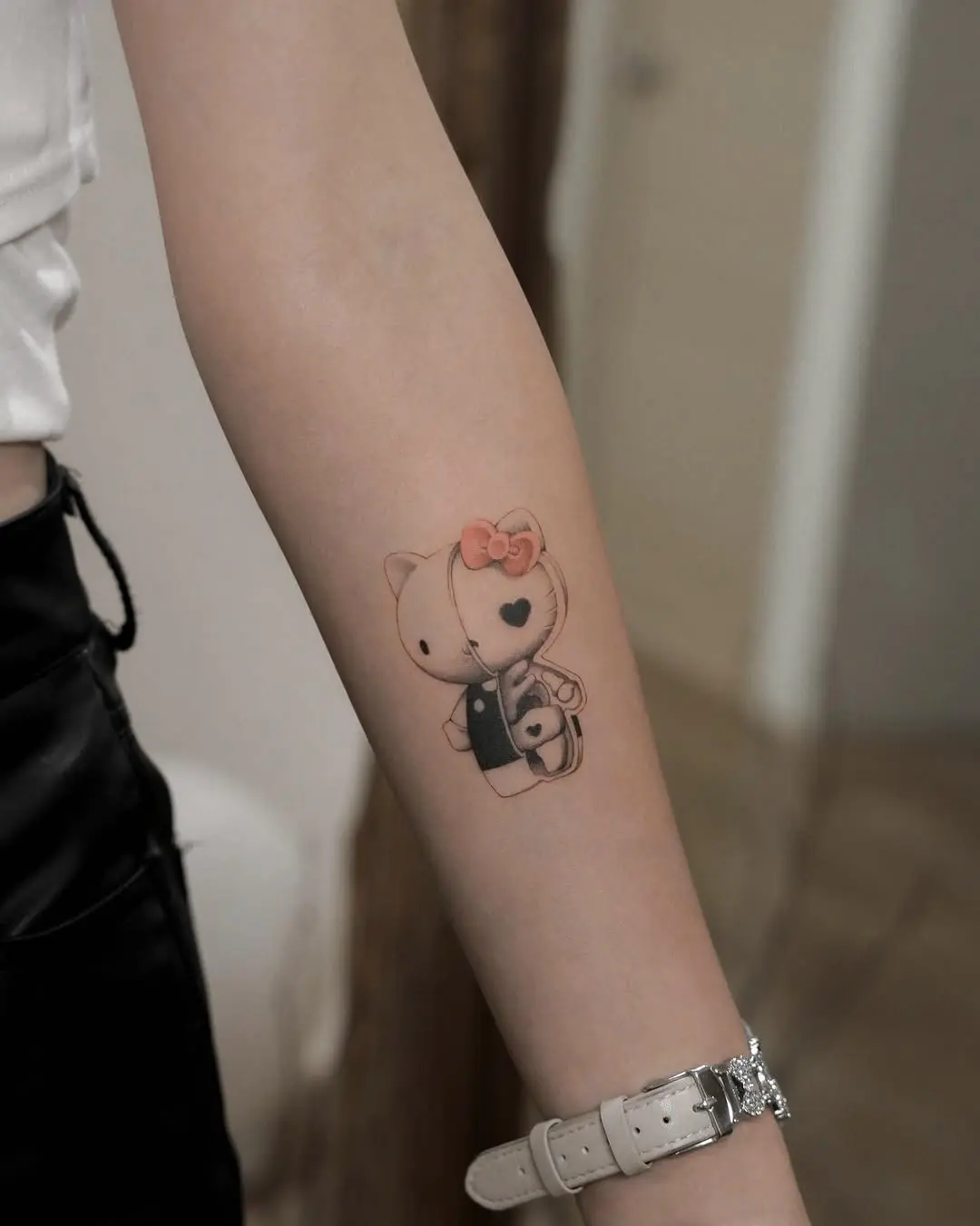Charming Hello Kitty Tattoo Design on Arm
