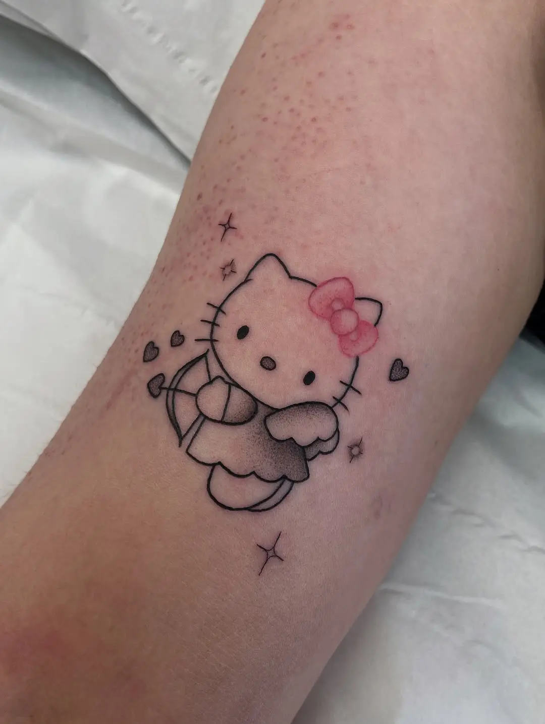 Adorable Hello Kitty Tattoo with Umbrella