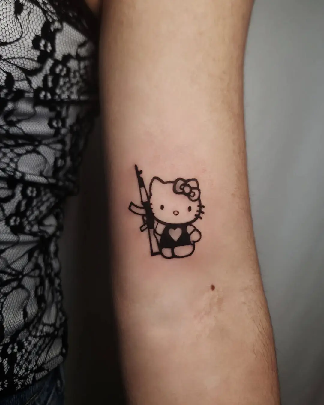 Adorable Hello Kitty Tattoo with a Heart