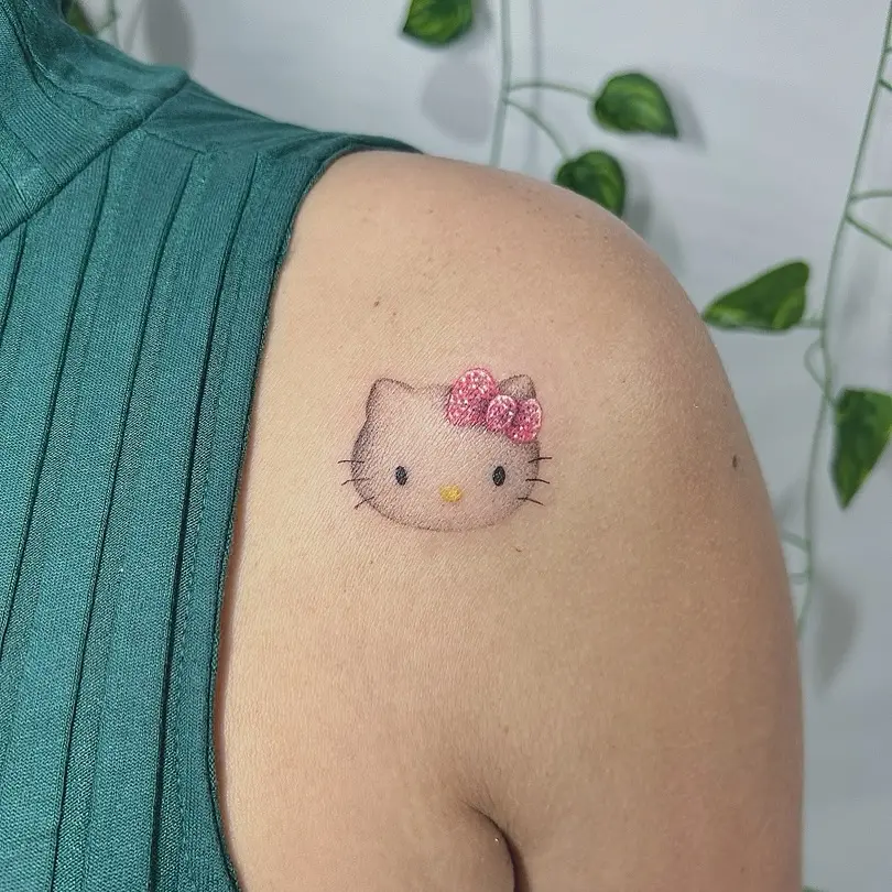 Adorable Hello Kitty tattoo on shoulder