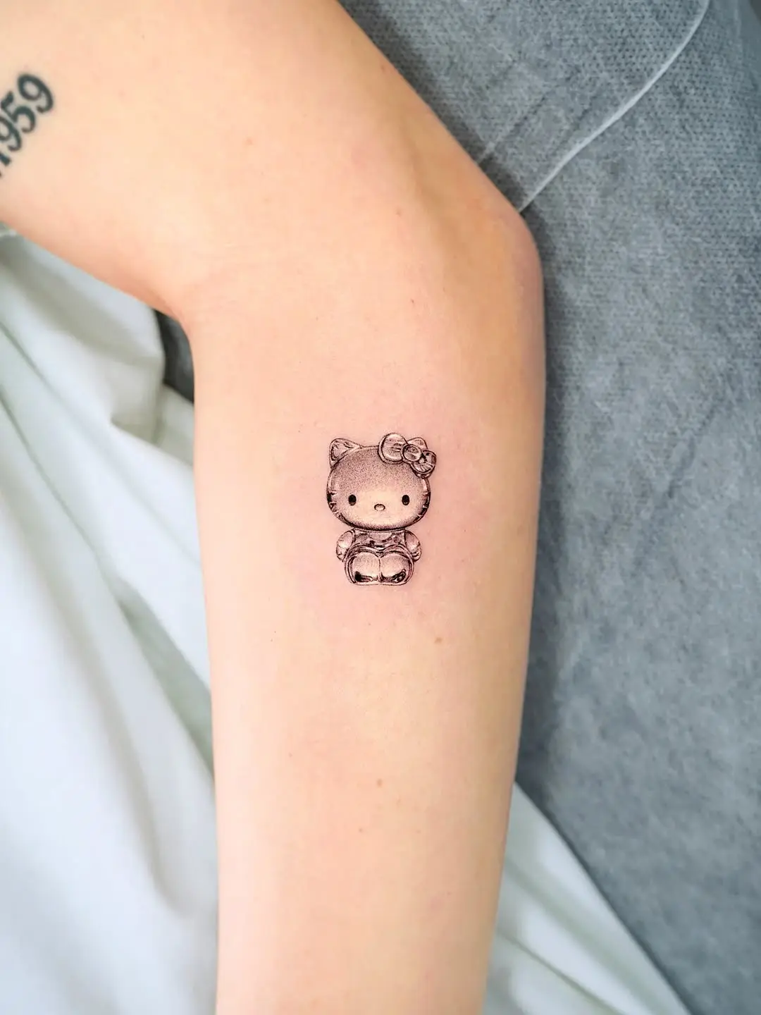 Adorable Hello Kitty tattoo on arm