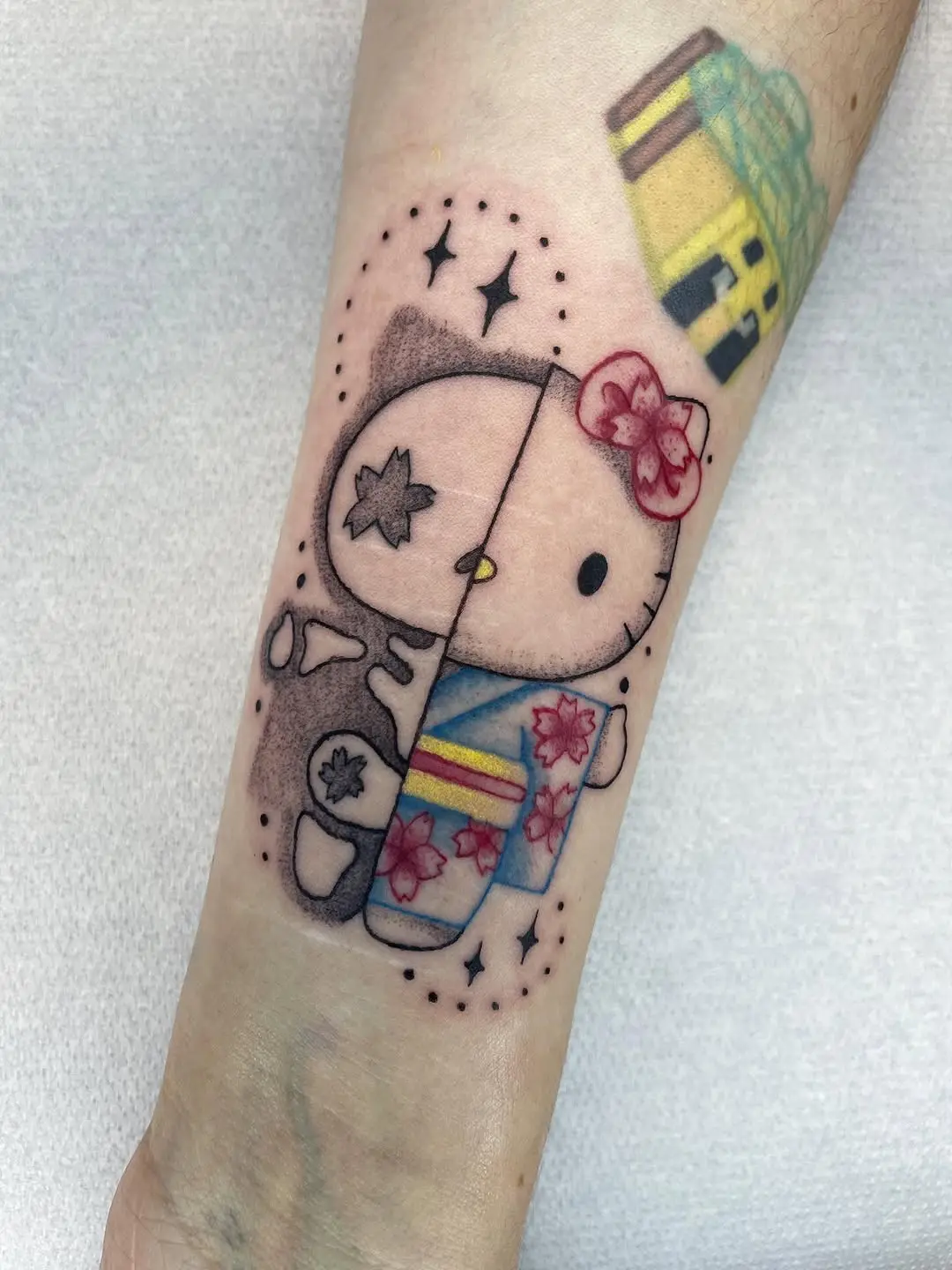 Unique Split Design of Hello Kitty Tattoo