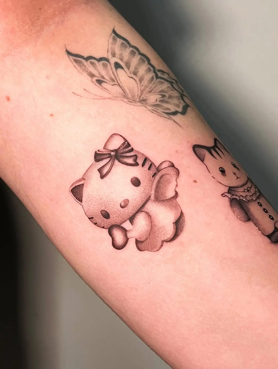 Adorable Hello Kitty Tattoo in Soft Colors