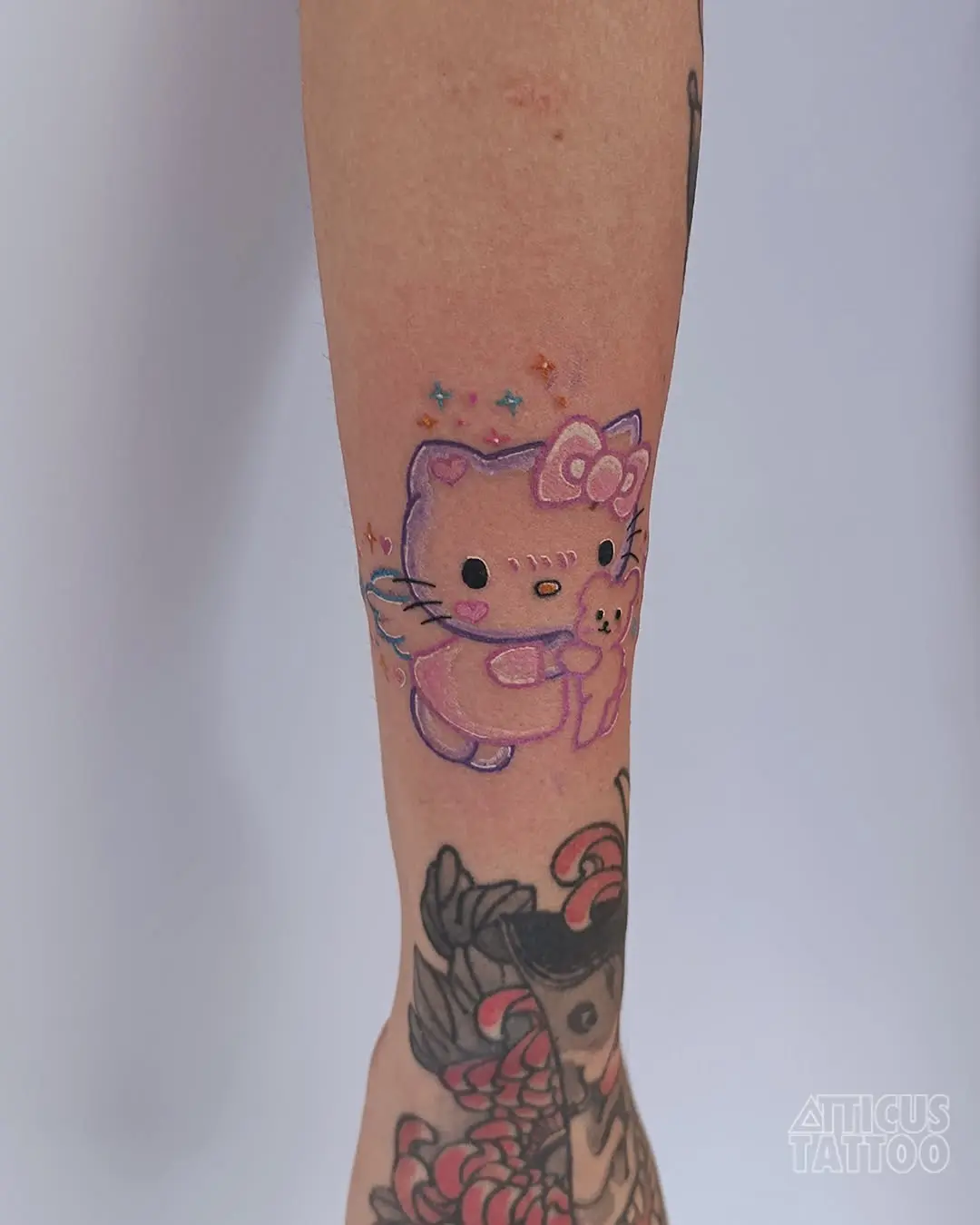 Whimsical Hello Kitty Tattoo with Soft Colors