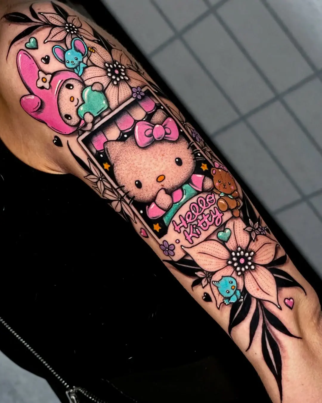 Vibrant Hello Kitty Floral Tattoo Design