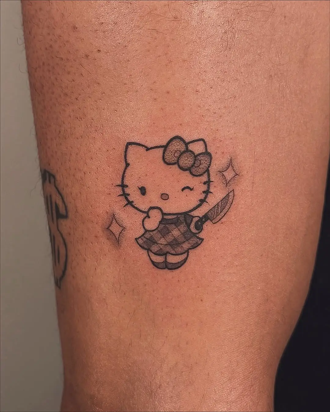 Adorably fierce Hello Kitty tattoo design