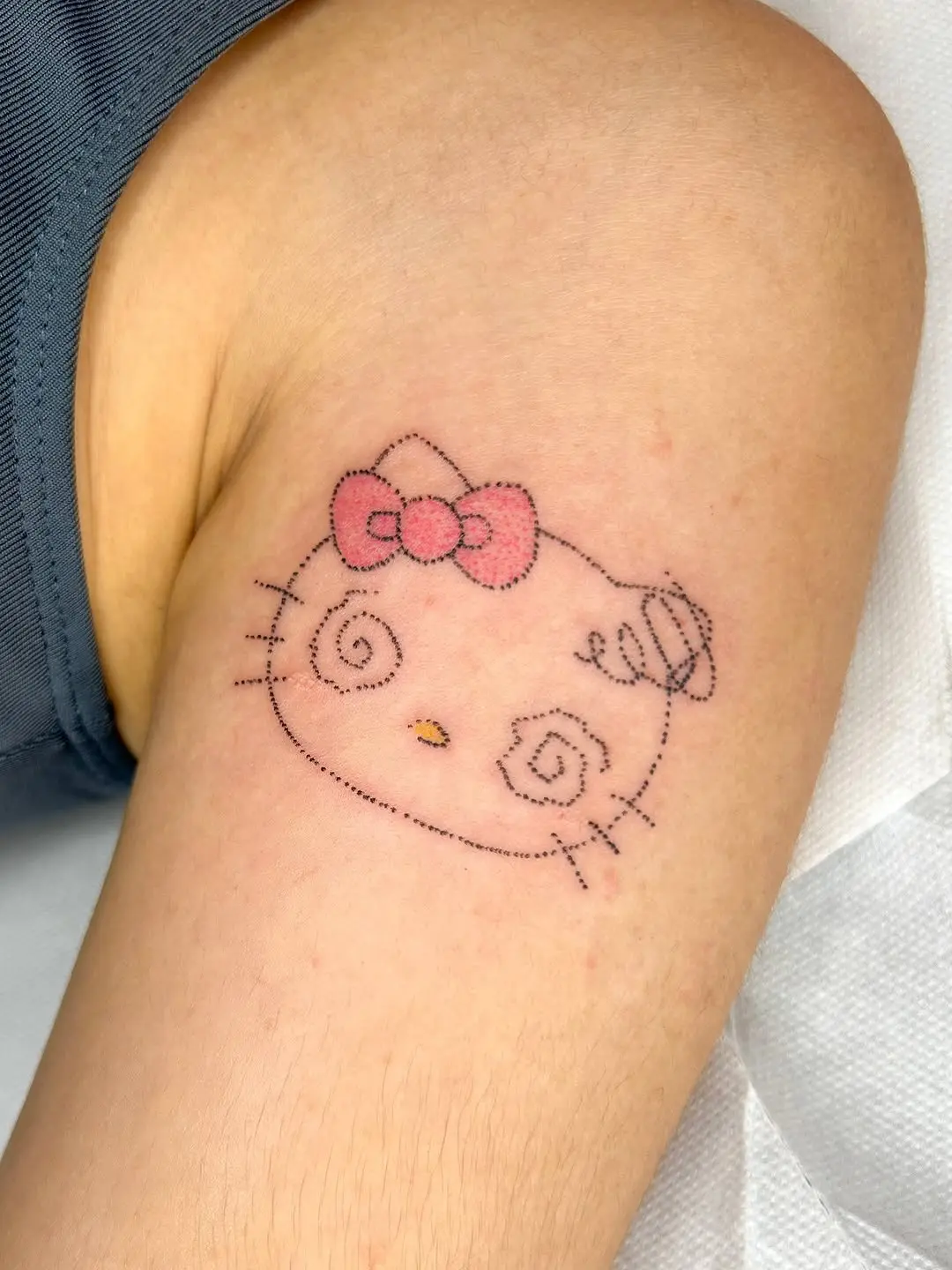 Charming Hello Kitty Swirly Tattoo Design