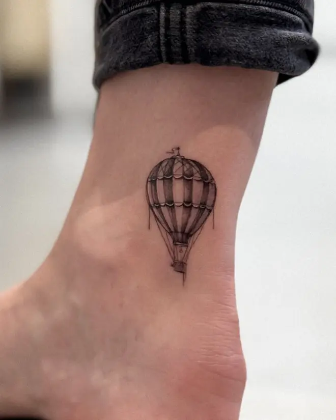Elegant hot air balloon tattoo on ankle