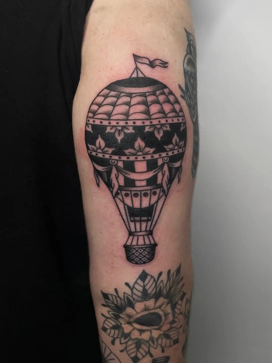 Stunning blackwork hot air balloon tattoo design
