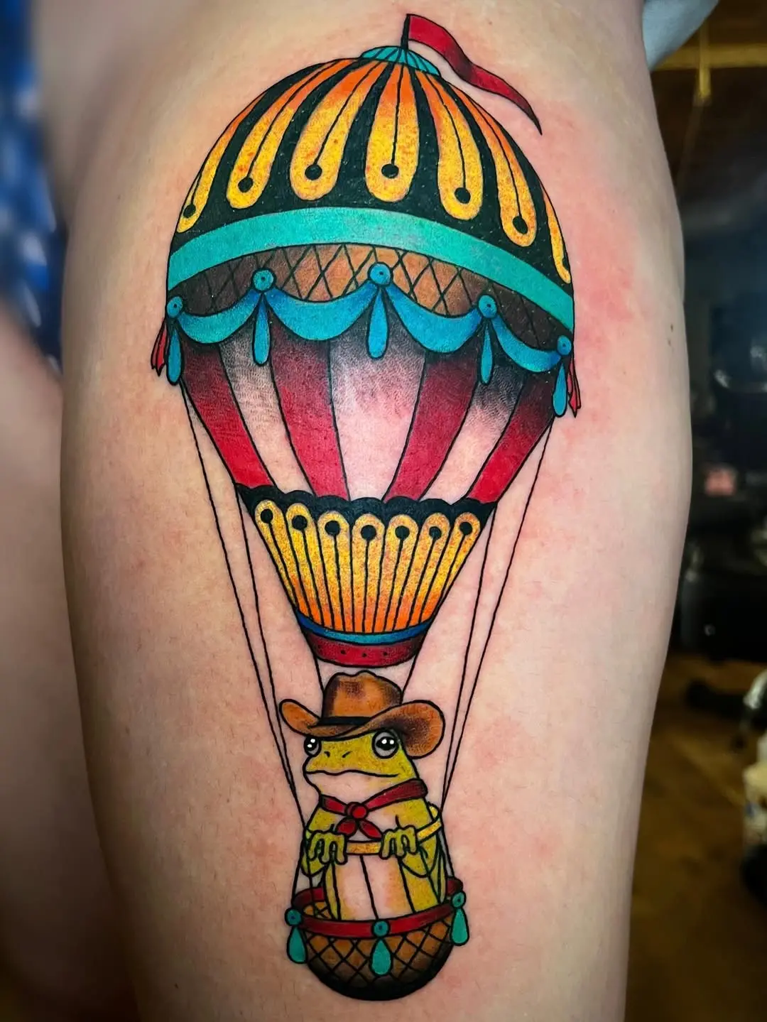 Whimsical Frog in a Colorful Balloon Tattoo