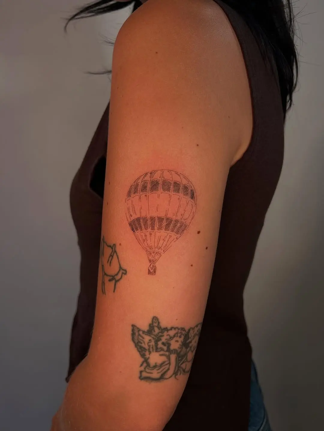 Elegant hot air balloon tattoo on the arm