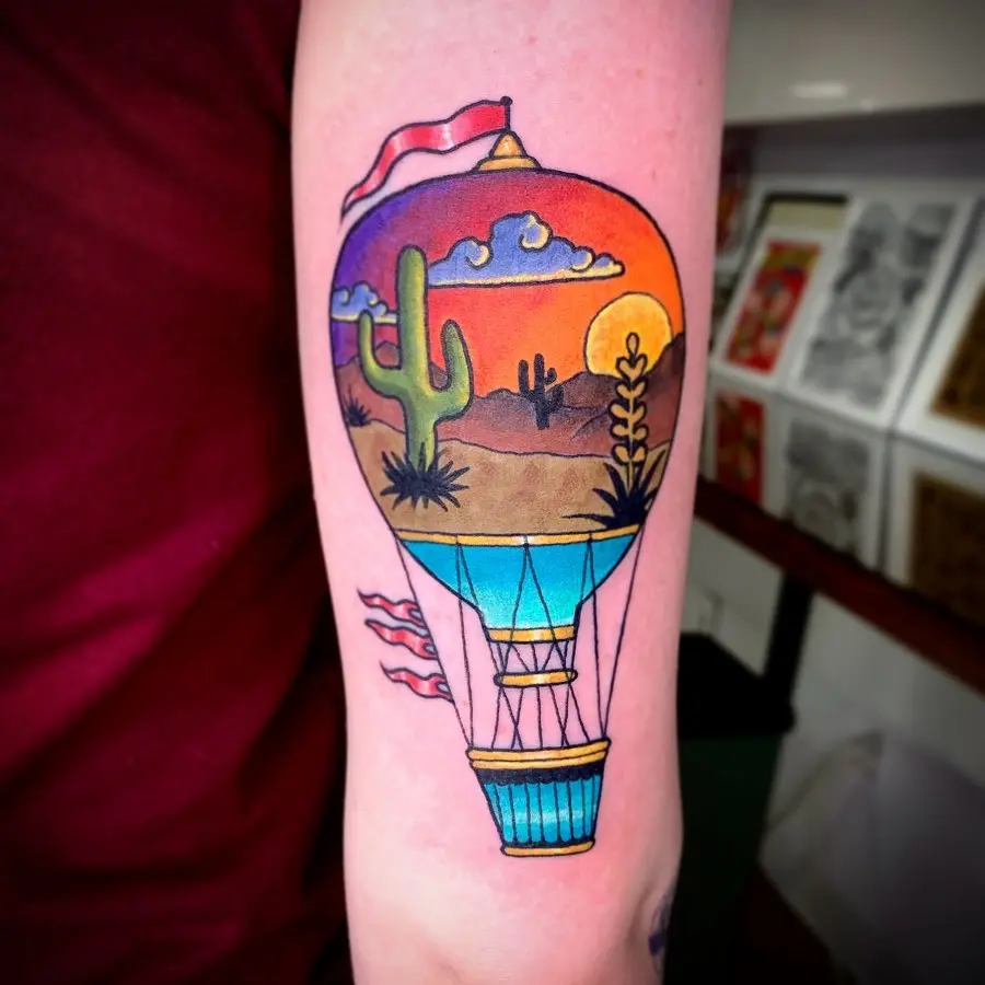 Vibrant hot air balloon tattoo with sunset vibes