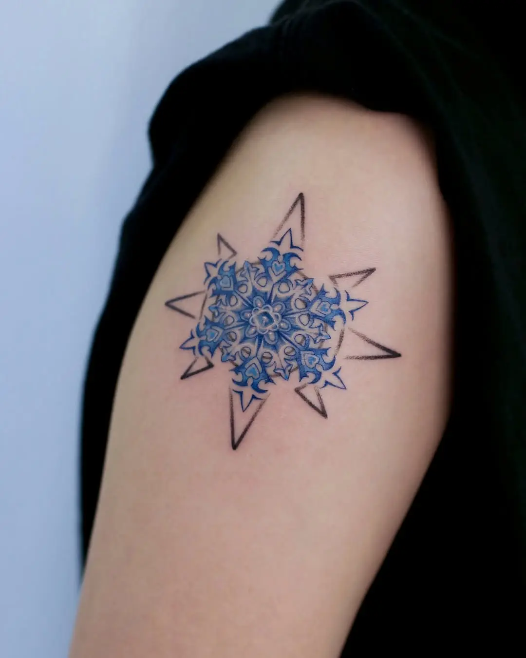 A stunning snowflake tattoo with intricate details
