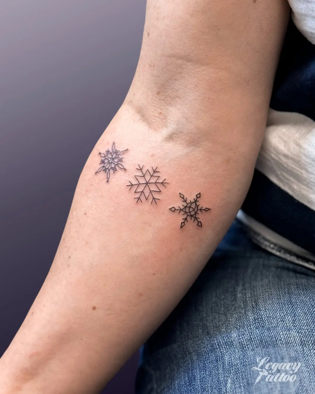 Elegant snowflake tattoos showcasing unique designs