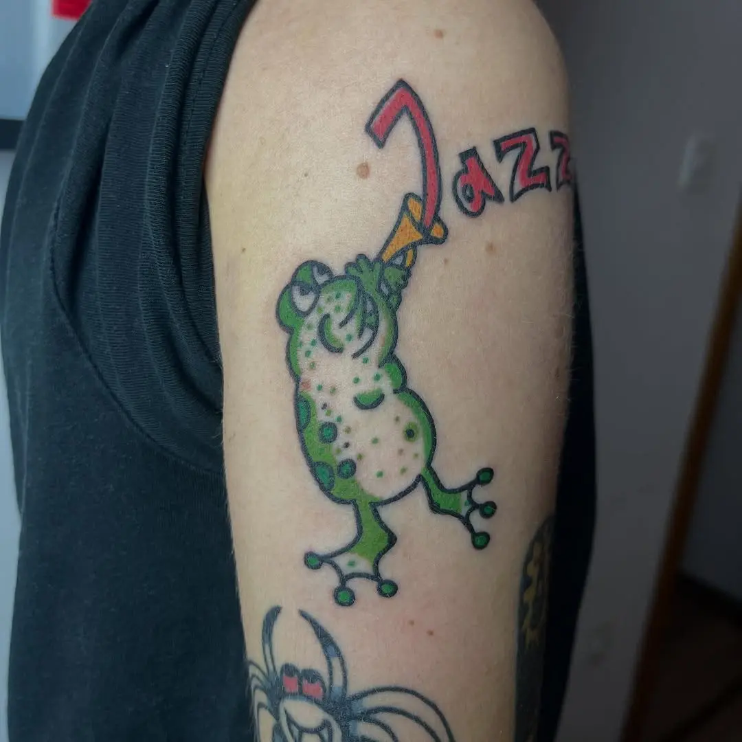 Whimsical jazz-loving frog tattoo design