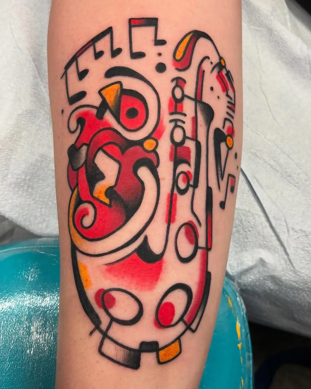 Vibrant saxophone tattoo with musical flair