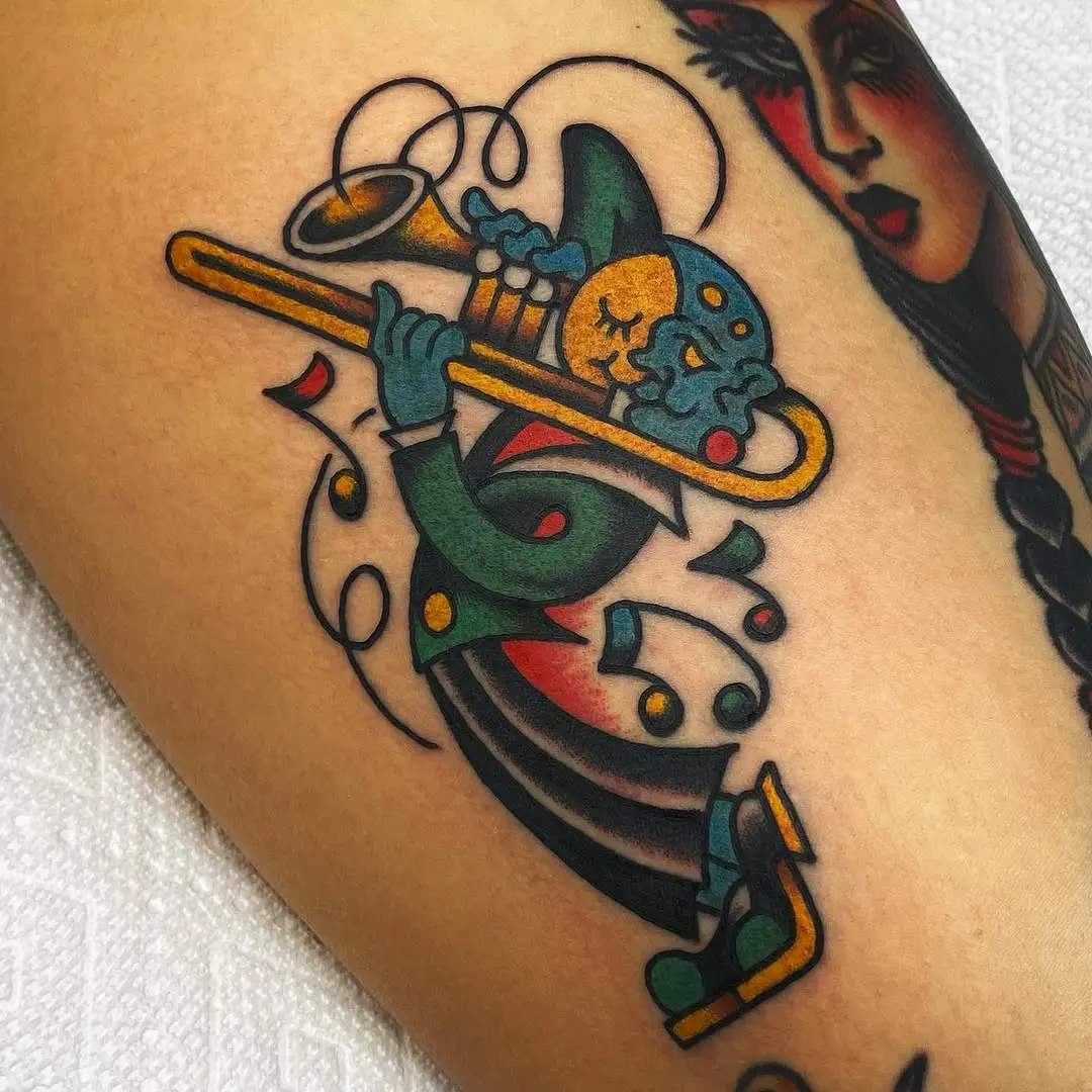 Colorful clown playing a trumpet tattoo