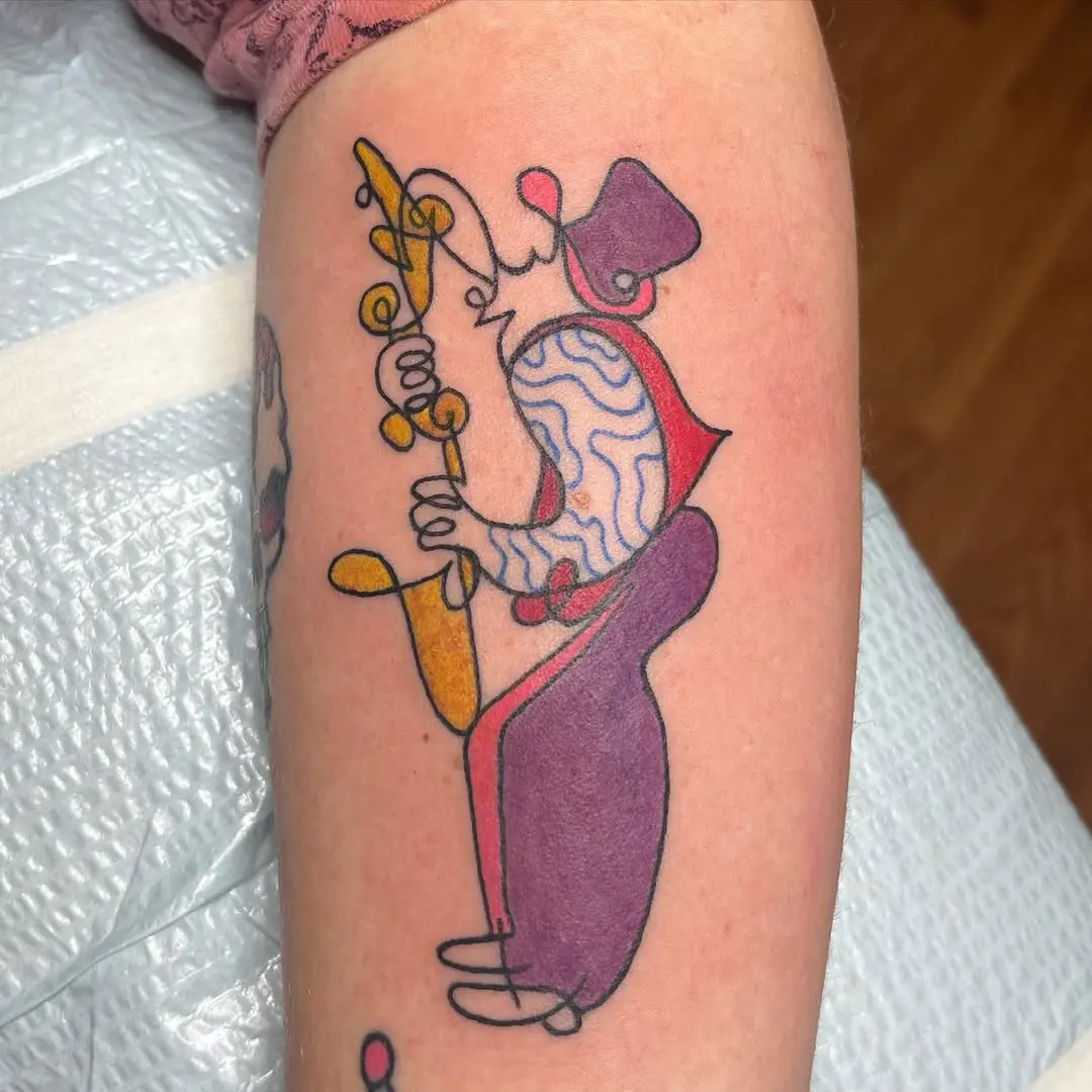Colorful saxophonist tattoo exuding musical vibes