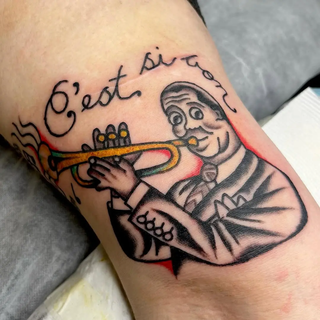 Classic jazz trumpet player tattoo with vibrant colors