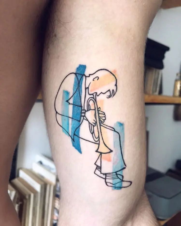 Vibrant trumpet player jazz tattoo in action