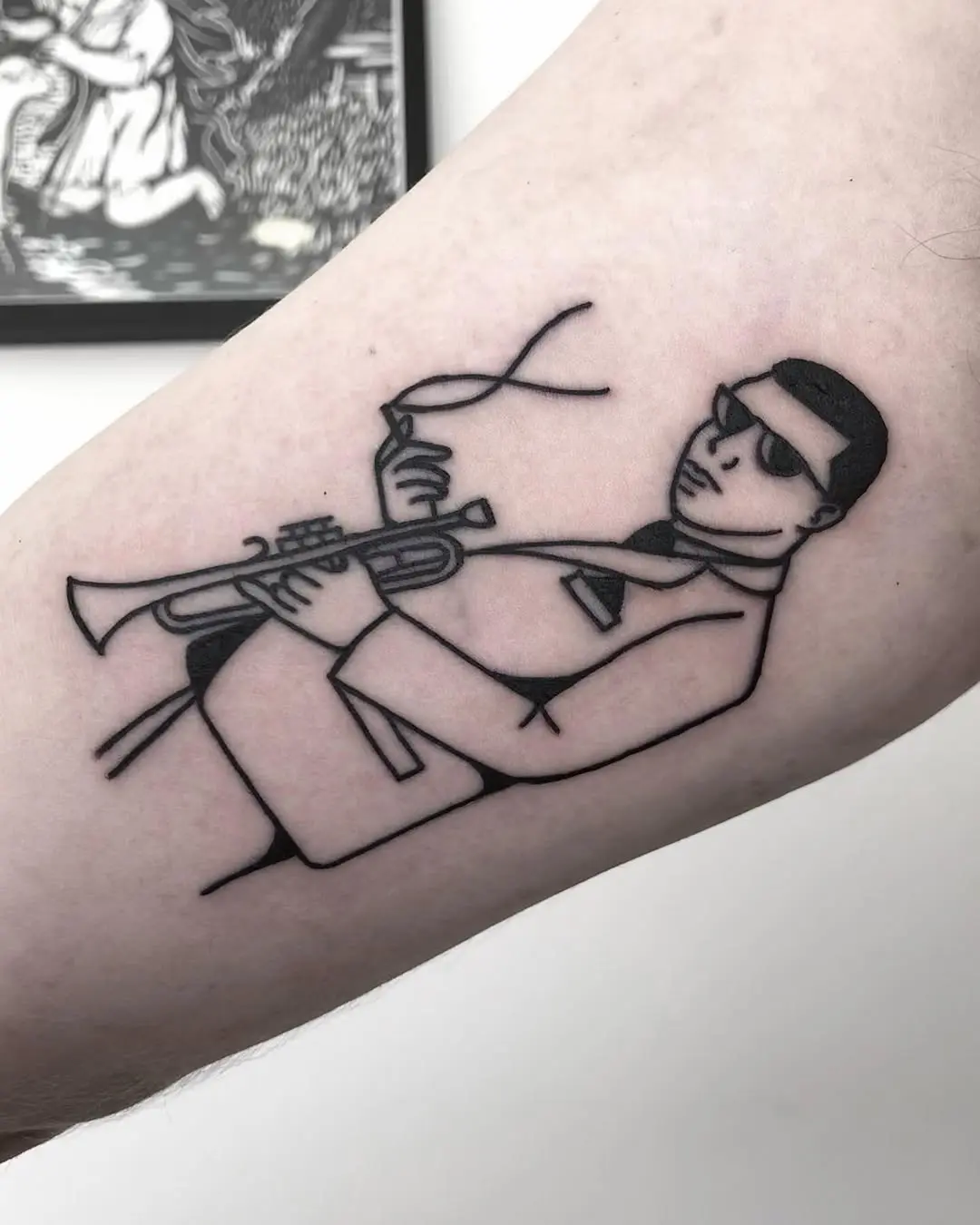 Stylish jazz musician tattoo in minimalist design