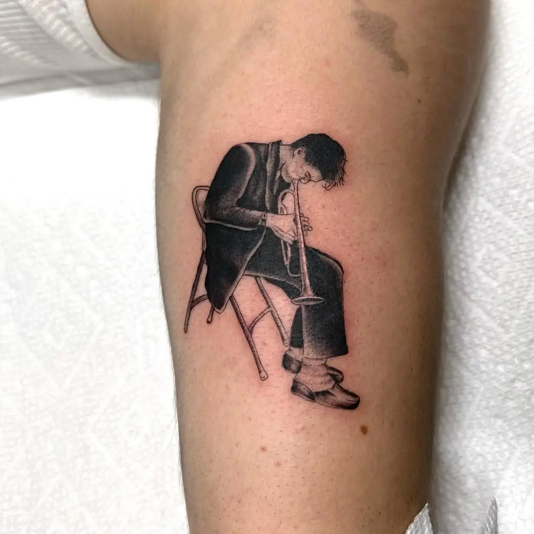 Stylish trumpet player tattoo inspired by jazz
