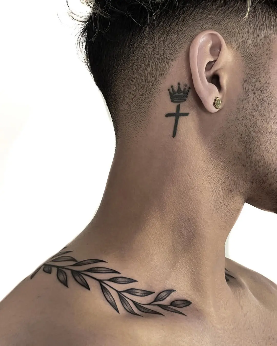 Stylish laurel wreath tattoo with crown accent