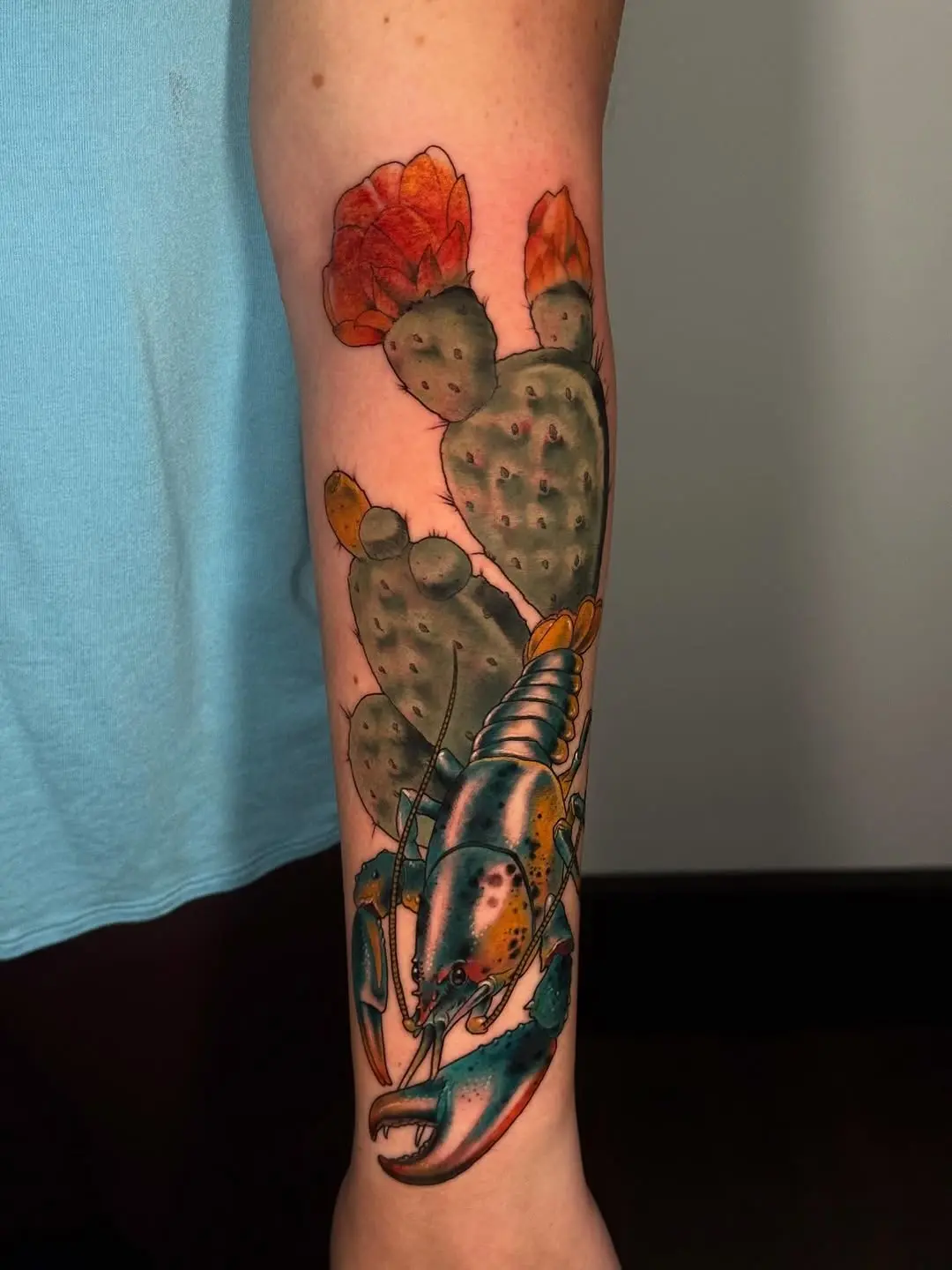Colorful lobster tattoo with cactus elements